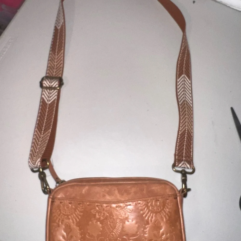 The Sak Embossed Brown Leather Phone Crossbody